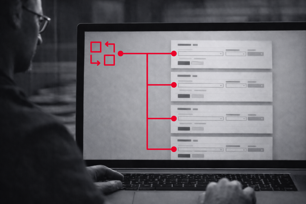 Eine Person schaut auf einen Laptop-Bildschirm, der ein Flussdiagramm mit roten Linien anzeigt, die Symbole mit verschiedenen Abschnitten eines Formulars oder einer Schnittstelle verbinden.